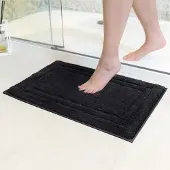 Unyqoos Wasbare antislip badmat in zwart voor veilige en droge badkamerervaring