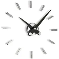 Nomon Puntos Suspensivos Wandklok 12ts | Chromed, Black Steel Hands