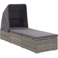 vidaXL Ligbed met luifel en kussen poly rattan grijs
