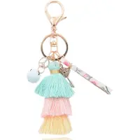 Deja Jewels Handgemaakte goudkleurige Boho sleutelhanger met kwastjes en schelp
