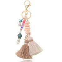 Deja Jewels Handgemaakte Ibiza sleutelhanger goudkleurig beige bruin met schelpjes