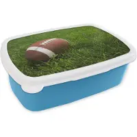 MuchoWow Broodtrommel Blauw - Lunchbox - Brooddoos - Close up van een American Football in het groene gras - 18x12x6 cm - Kinderen - Jongen