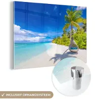 MuchoWow Glasschilderij 180x120 cm - Schilderij acrylglas - Strand - Palm - Hangstoel - Foto op glas - Muurdecoratie woonkamer - Wanddecoratie slaapkamer - Schilderijen