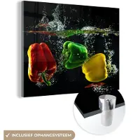 MuchoWow Glasschilderij 160x120 cm - Schilderij acrylglas - Paprika - Groente - Water - Zwart - Rood - Groen - Geel - Foto op glas - Schilderijen