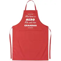Kariban Mijncadeautje Schort - We have a hero, GRANDMA - opdruk wit - mooie en exclusieve keukenschort - rood