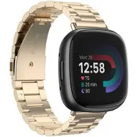 Strap-it Stalen schakel bandje - horlogeband metaal geschikt voor Fitbit Versa 4 / Sense 2 - champagne goud