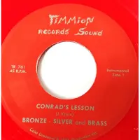Konkurrent Silver Bronze & Brass - Conrad's Lesson (7" Single) (Coloured Vinyl)