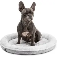 Lionto hondenbed met zacht, donutvormig ontwerp, voorzien van pluche en een antislipbodem. De hoes is wasbaar. Diameter: 65 cm. Kleur: grijs