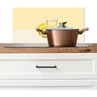 KitchenYeah Spatscherm keuken 70x30 cm - Kookplaat achterwand Glas - Citroenschijfjes - Geel - Muurbeschermer - Spatwand fornuis - Hoogwaardig aluminium