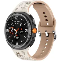 Strap-it Bloemvormig Siliconen Horlogebandje – Comfortabel, stijlvol & flexibel – geschikt voor Samsung Galaxy Watch 8 (40mm/44mm) & Galaxy Watch 8 Classic (46mm) – Sterrenlicht & Beige