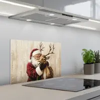 KitchenYeah Spatscherm 60x40 cm - Zelfklevende achterwand Kerstman - Rendier - Sneeuw - Kleurrijk - Keuken muurbeschermer - Spatwand fornuis