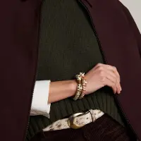 Manfield - Dames - Goudkleurige zebra armband met rode details - Maat 1
