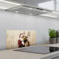 KitchenYeah Spatscherm 60x30 cm - Zelfklevende achterwand Kerstman - Rendier - Sneeuw - Kleurrijk - Keuken muurbeschermer - Spatwand fornuis