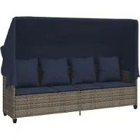 vidaXL Ligbed met luifel en kussens poly rattan grijs