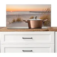 KitchenYeah Spatscherm keuken 90x45 cm - Kookplaat achterwand Pier - Zonsondergang - Strand - Muurbeschermer - Spatwand fornuis - Hoogwaardig aluminium