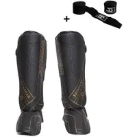 Joya ESSENTIAL Scheenbeschermers – Maat M – Zwart/Goud – Kickboksen/Muay Thai/MMA – Ergonomische pasvorm, schokabsorberende padding – Inclusief Bandage
