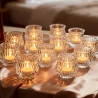 Famanu – Set van 12 geribbelde glazen theelichthouders, kleine kaarshouders voor sfeervolle tafeldecoratie op bruiloften en kerstfeesten
