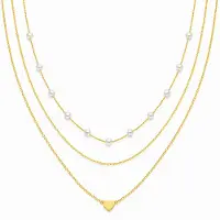 LGT JWLS Goudkleurige Set van 3 Dameskettingen met Witte Synthetische Parels en Harthanger