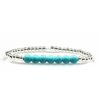 Heaven Eleven Stoere zilverkleurige kralenarmband met turquoise kralen